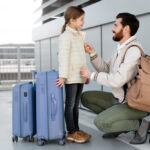 Full shot man and girl traveling