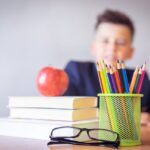 Boy Looking On A Tidied Desk