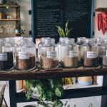 Clear Glass Jars on White Wooden Shelf