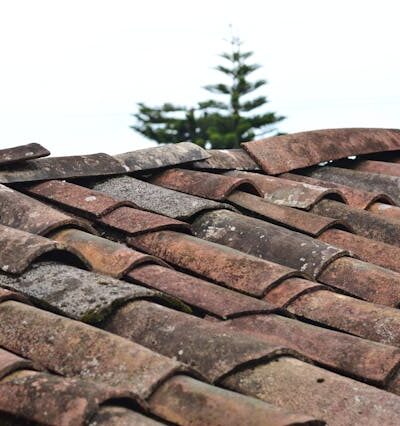 Selective Focus Photo of Brown Roof Shingles
