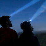 Man and woman with head lights