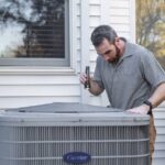 Technician Inspecting Outdoor HVAC Unit