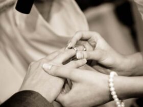 Husband and wife exchanging rings at an engagement ceremony
