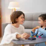 mother and kid playing memory game