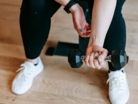 woman training with dumbbell in sport club
